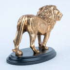 Standing gold lion figurine with sculpted mane and tail