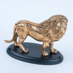 Standing gold lion figurine with sculpted mane and tail
