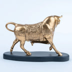 Gold-toned bull showpiece with sculpted horns and ornate detailing