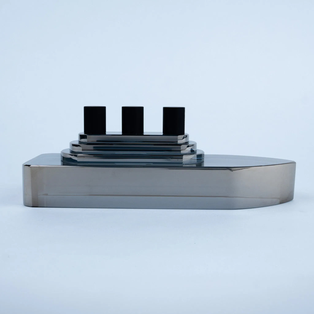 Smoky grey glass ship decor with stepped deck and black details