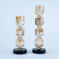 Champagne and amber geometric candle holder set of two with black bases