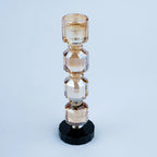 Modern decorative candle holder with stacked geometric forms and black bases
