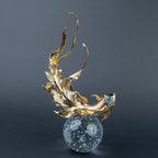 Luxury gold fish showpiece featuring detailed scales, blue embellishments and clear base.