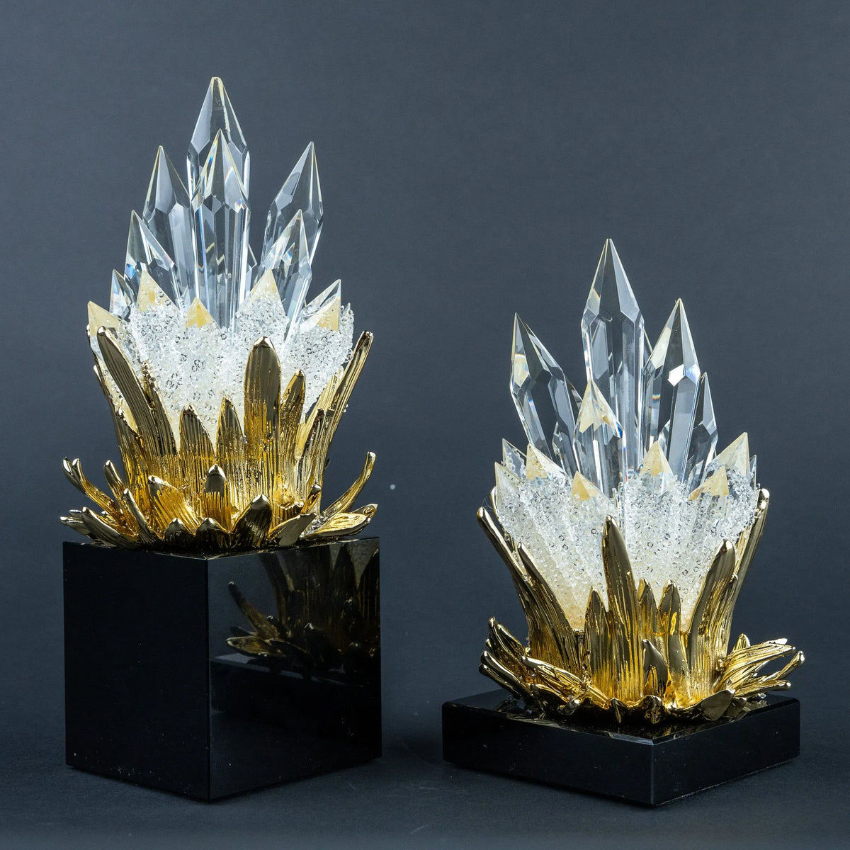 Gold, clear and black decorative accents styled together on a modern console table