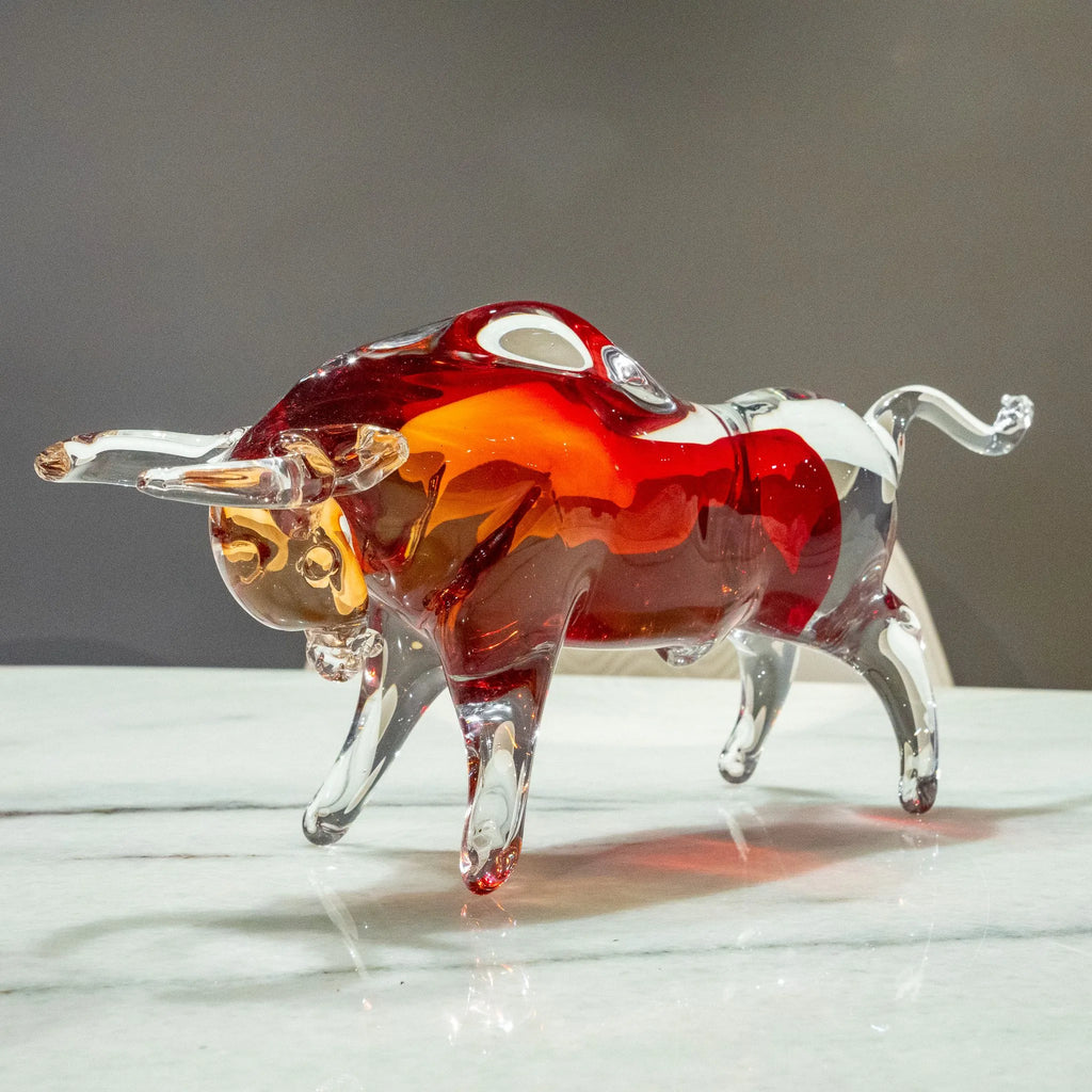 Ruby red bull figurine with amber and clear decorative details