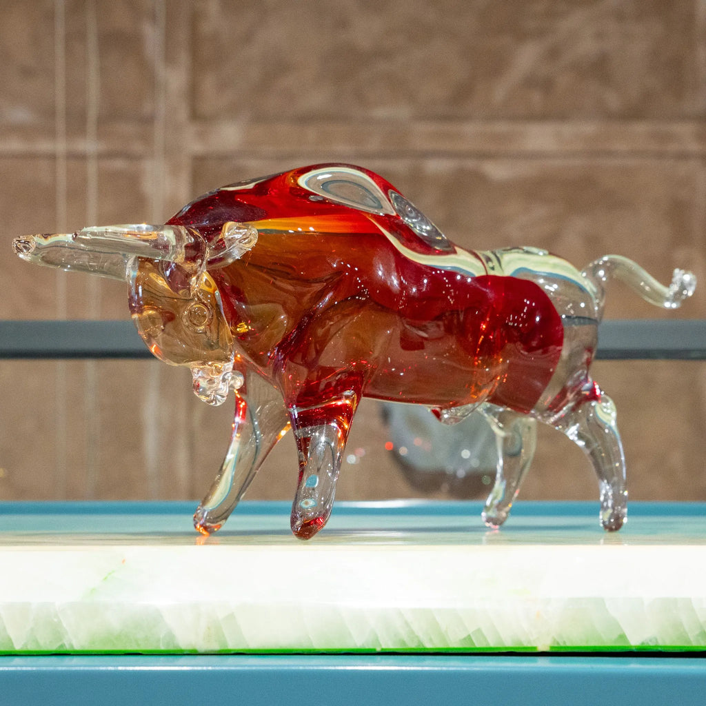 Red bull decorative accent with transparent legs and amber detailing