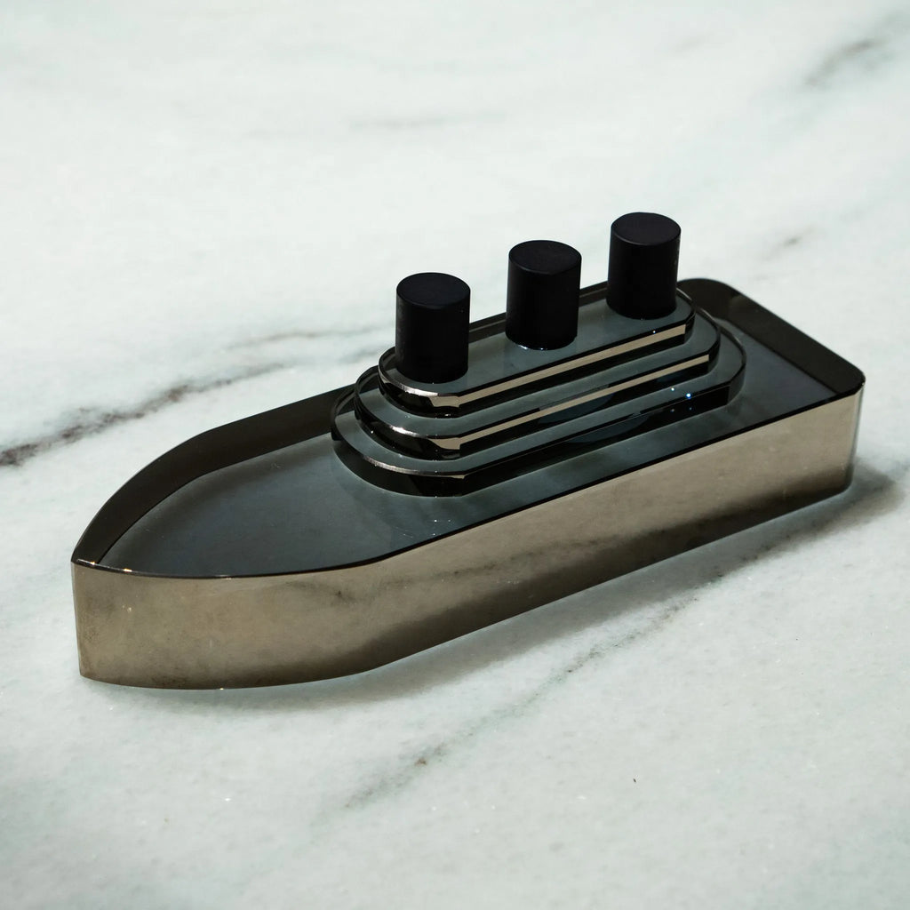 Smoky grey glass ship decor with stepped deck and black details