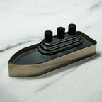 Smoky grey glass ship decor with stepped deck and black details