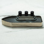Glass ship showpiece with black details and reflective finis