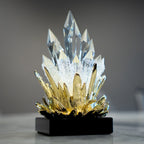 Large and small flame-inspired decorative accents displayed together on a marble surface