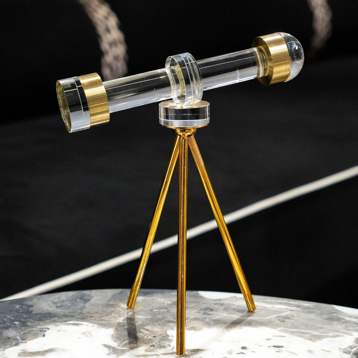 Decorative telescope table accent with transparent barrel and gold-toned ends