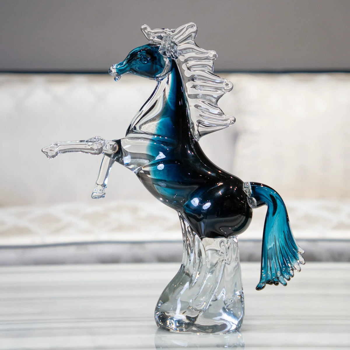 Blue crystal horse figurine with sapphire-blue accents and transparent detailing