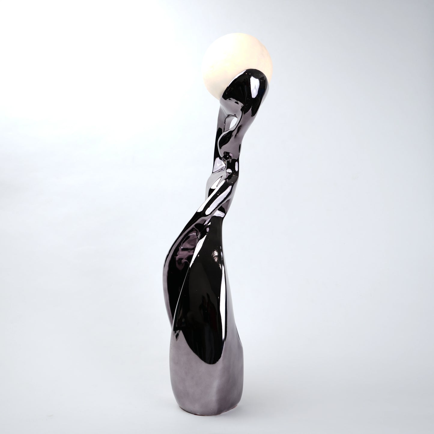 Decorative sculpture with a glossy finish on a white background
