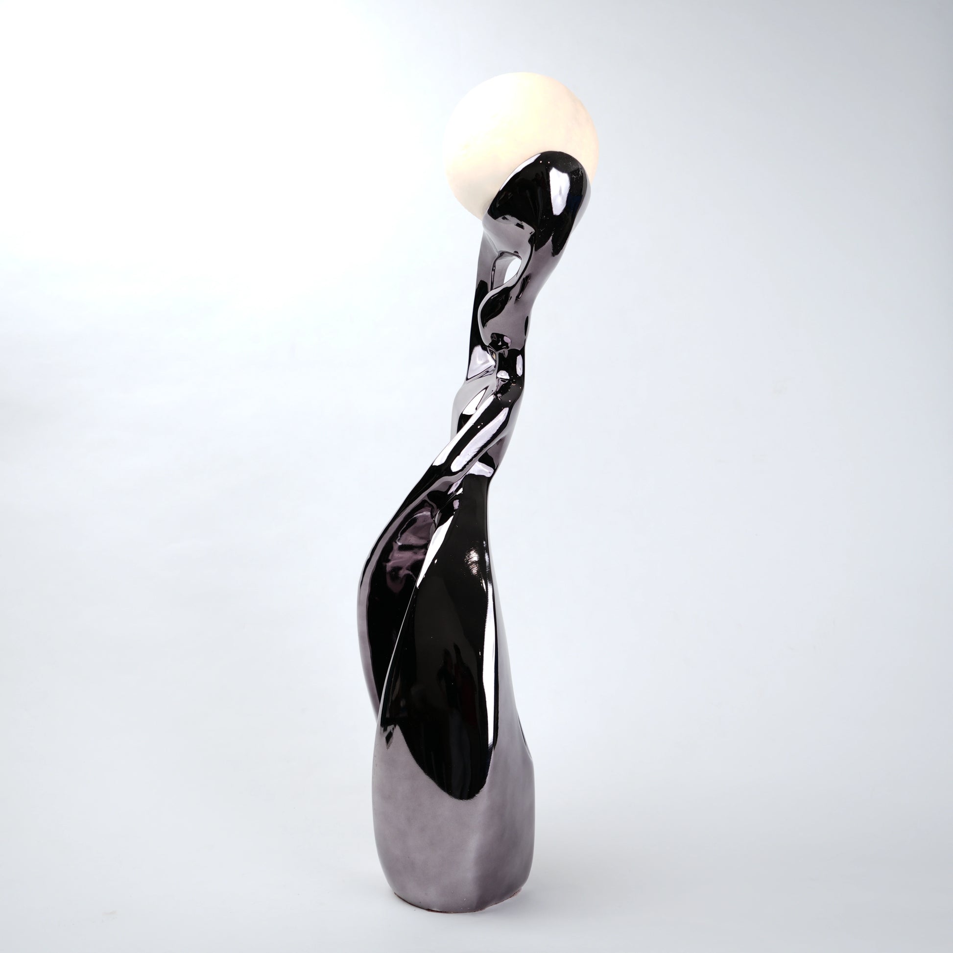 Decorative sculpture with a glossy finish on a white background