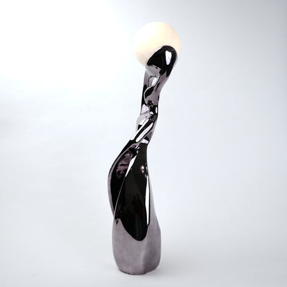 Decorative sculpture with a glossy finish on a white background
