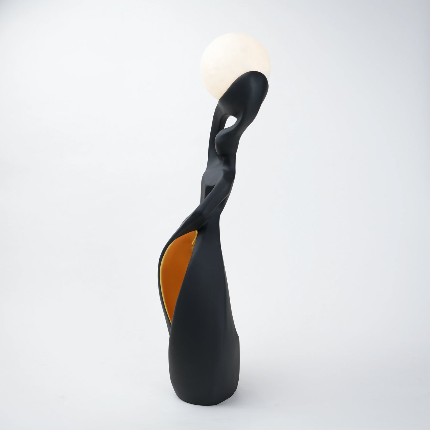 modern sculptural table lamp with glowing orb ambient lighting