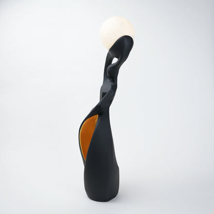 modern sculptural table lamp with glowing orb ambient lighting