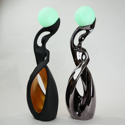 modern sculptural table lamp with glowing orb ambient lighting