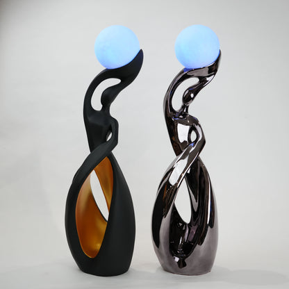 modern sculptural table lamp with glowing orb ambient lighting