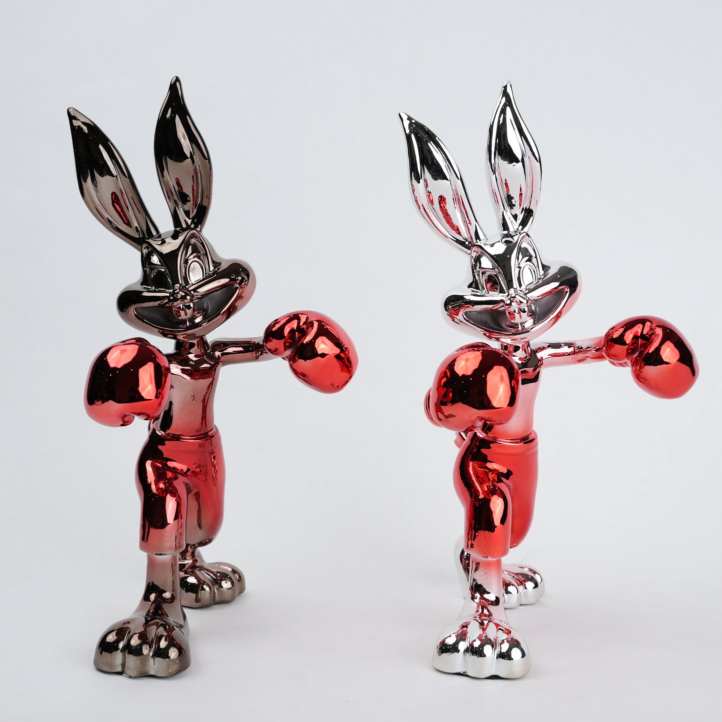 Resin bunny boxer figurine with chrome black finish and scarlet red gloves and shorts