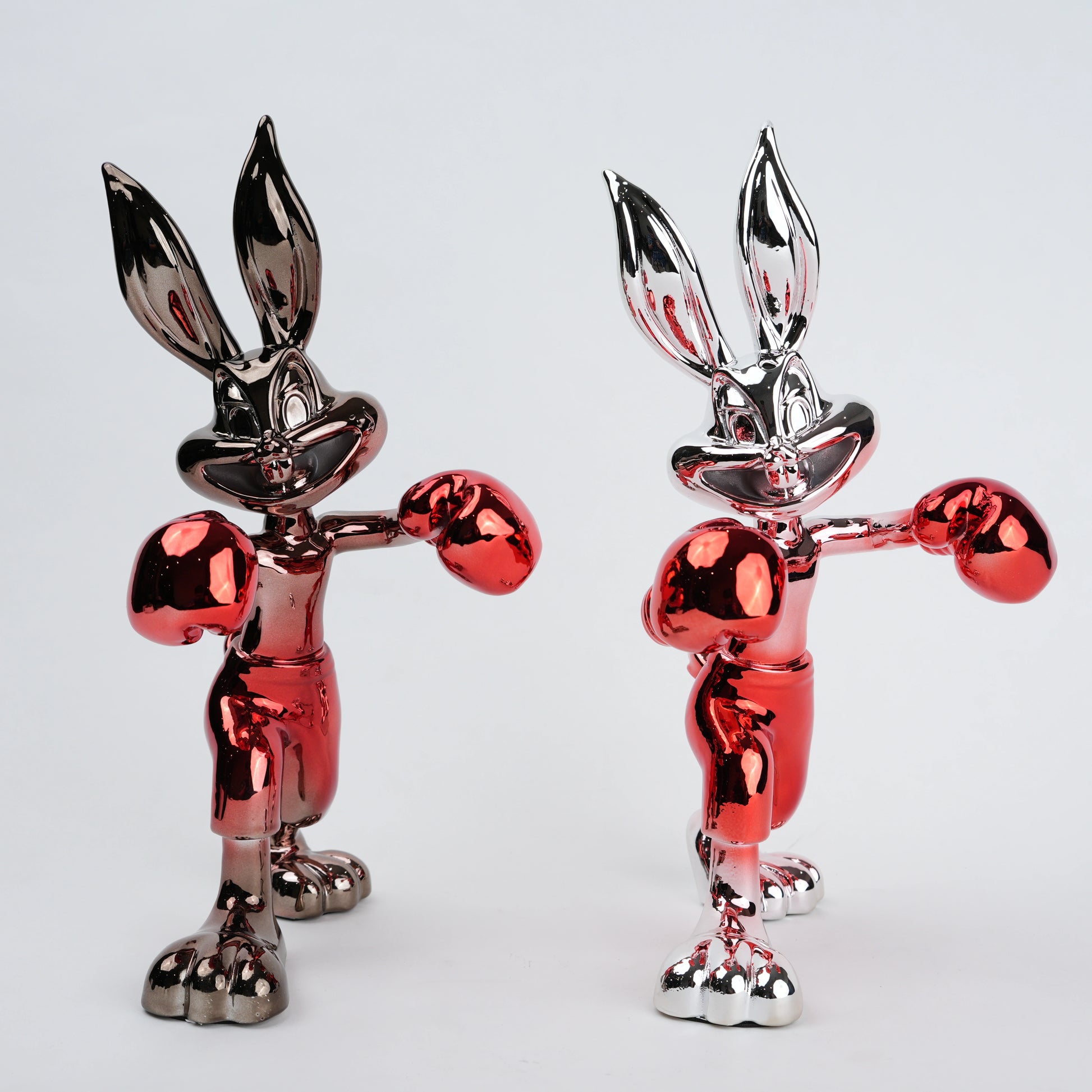 Resin bunny boxer figurine with chrome black finish and scarlet red gloves and shorts