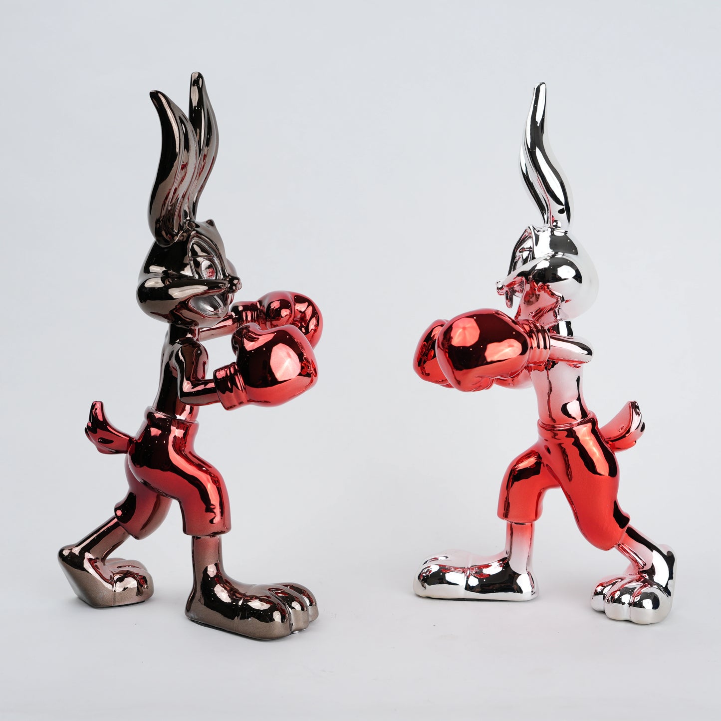 Resin bunny boxer figurine with chrome black finish and scarlet red gloves and shorts