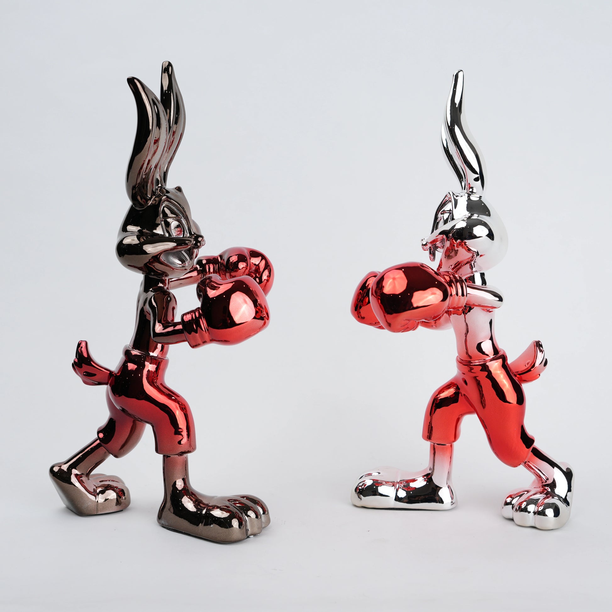 Resin bunny boxer figurine with chrome black finish and scarlet red gloves and shorts