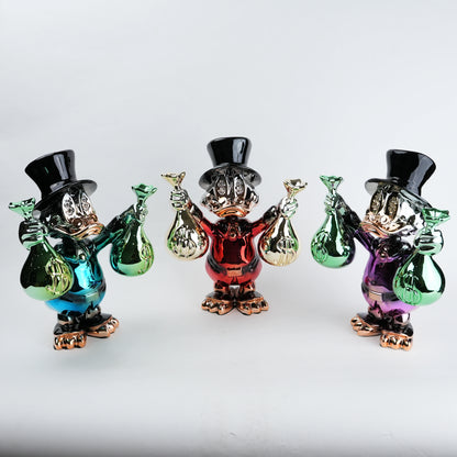 Three colorful glass figurines with top hats and bags on a white background