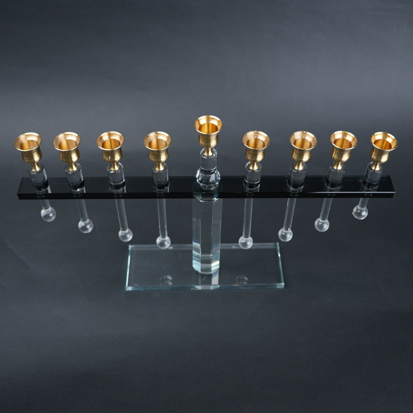 linear crystal candle holder with gold cups and transparent base for modern table decor