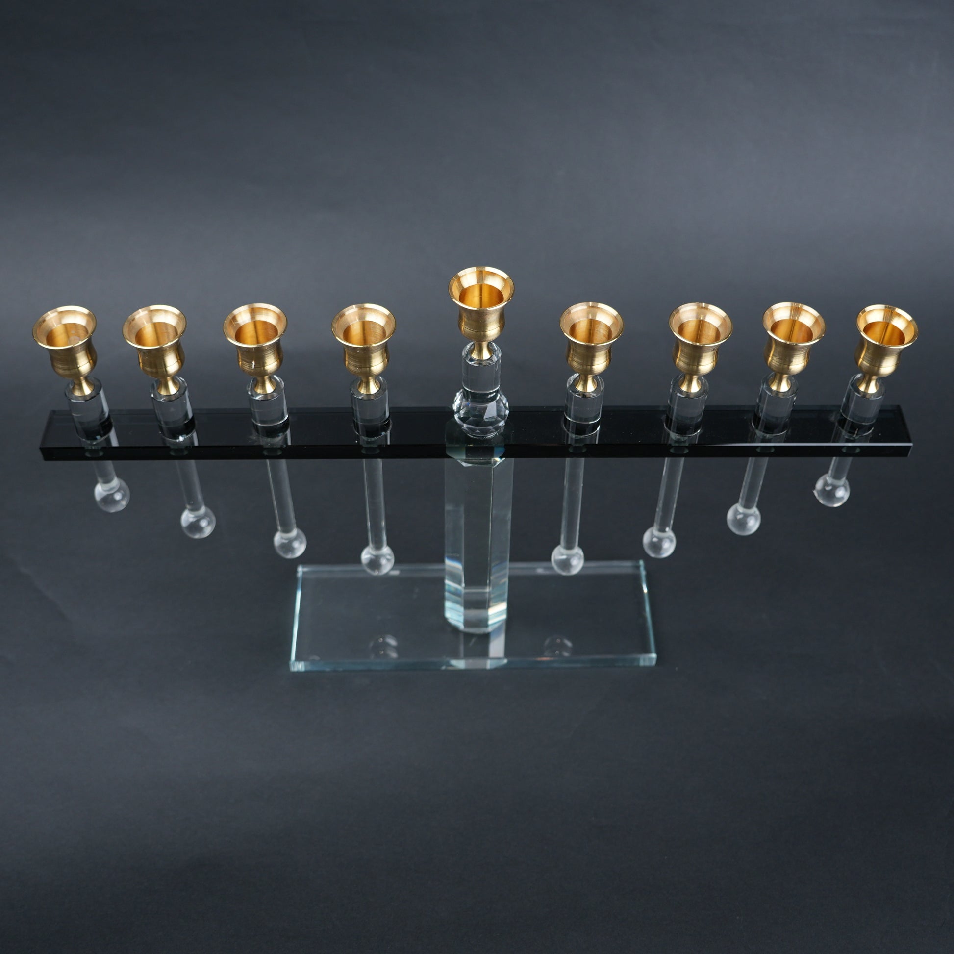 linear crystal candle holder with gold cups and transparent base for modern table decor