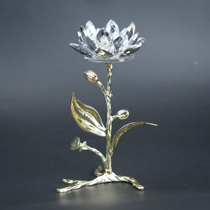 Decorative crystal flower with gold base on a dark background