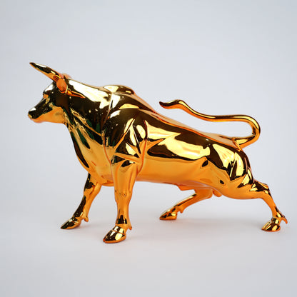 Gold bull figurine on a light gray background