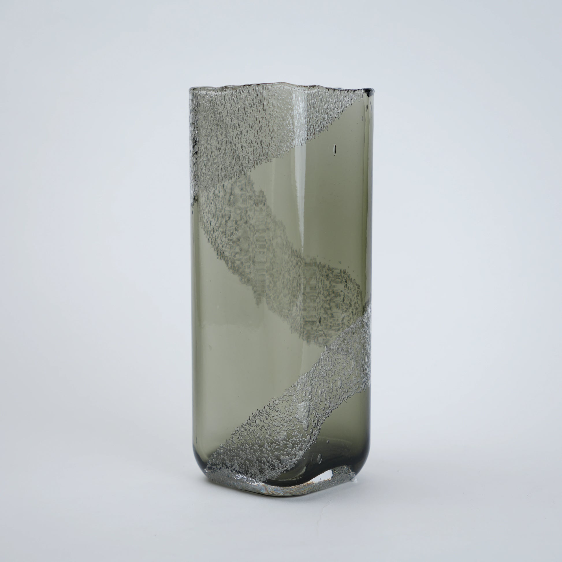 Decorative glass vase with textured surface on a white background