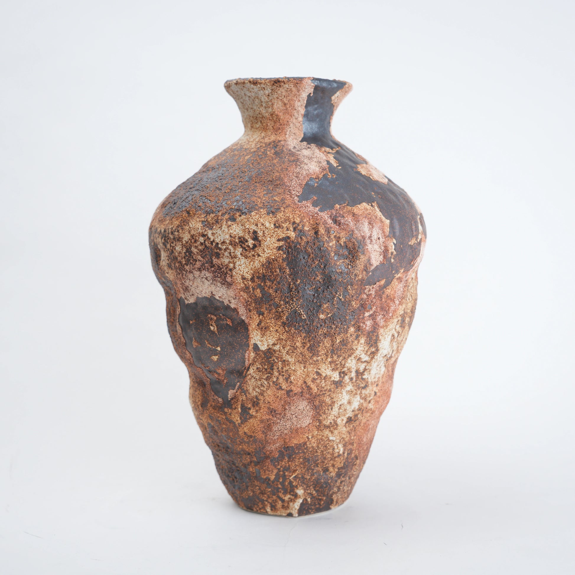 Rustic brown ceramic vase on a white background