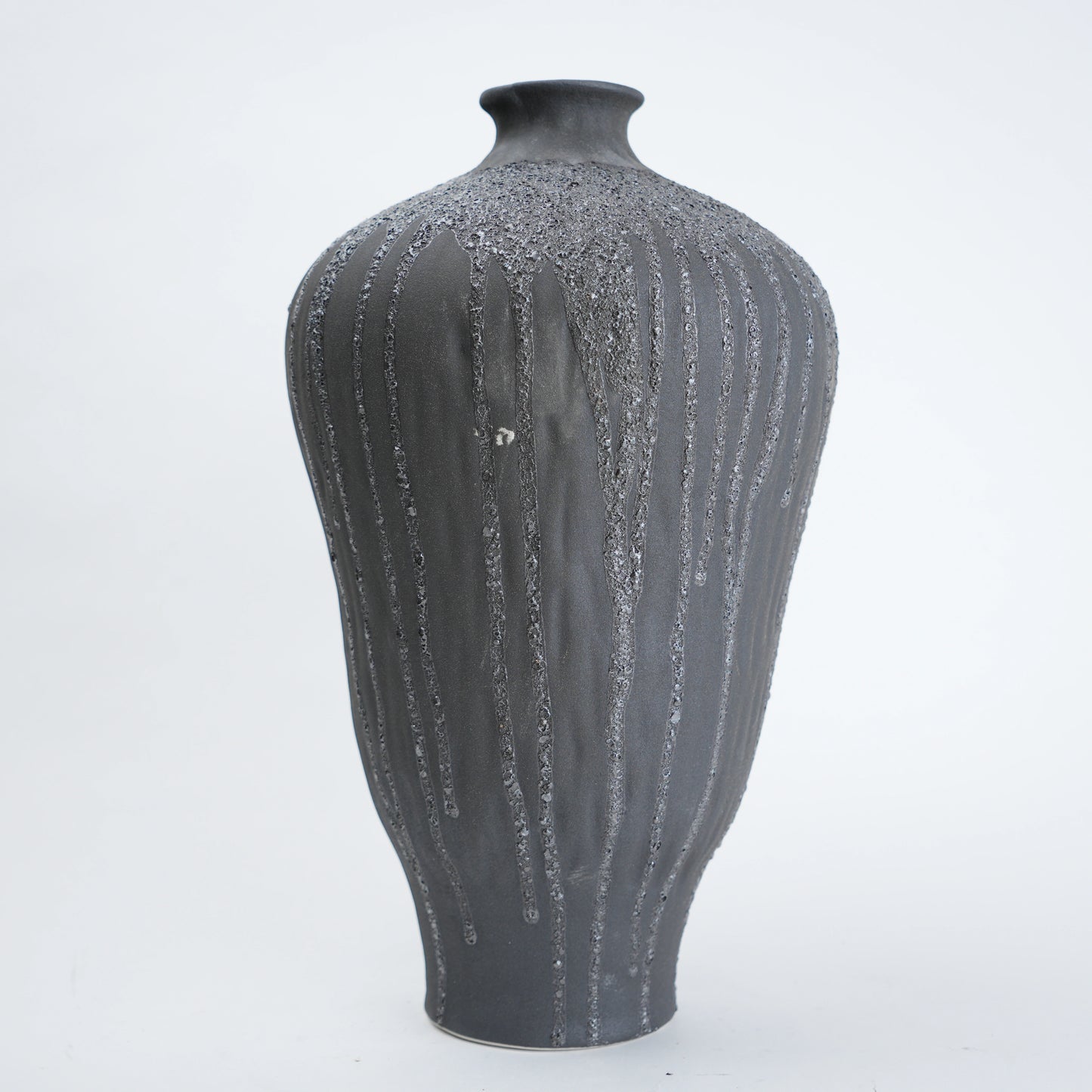 Gray textured vase on a white background