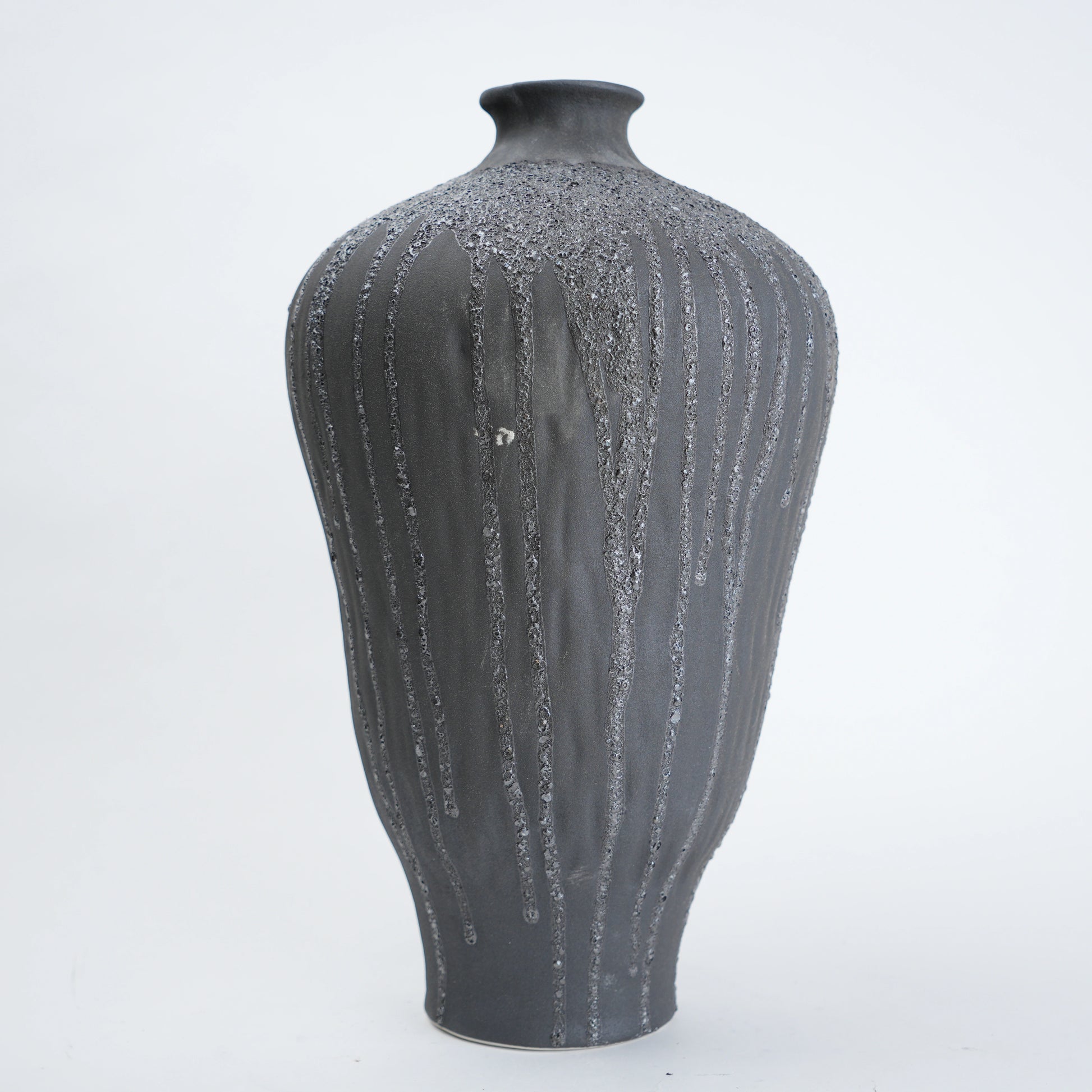 Gray textured vase on a white background