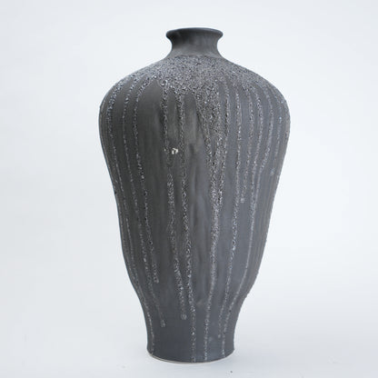 Gray textured vase on a white background