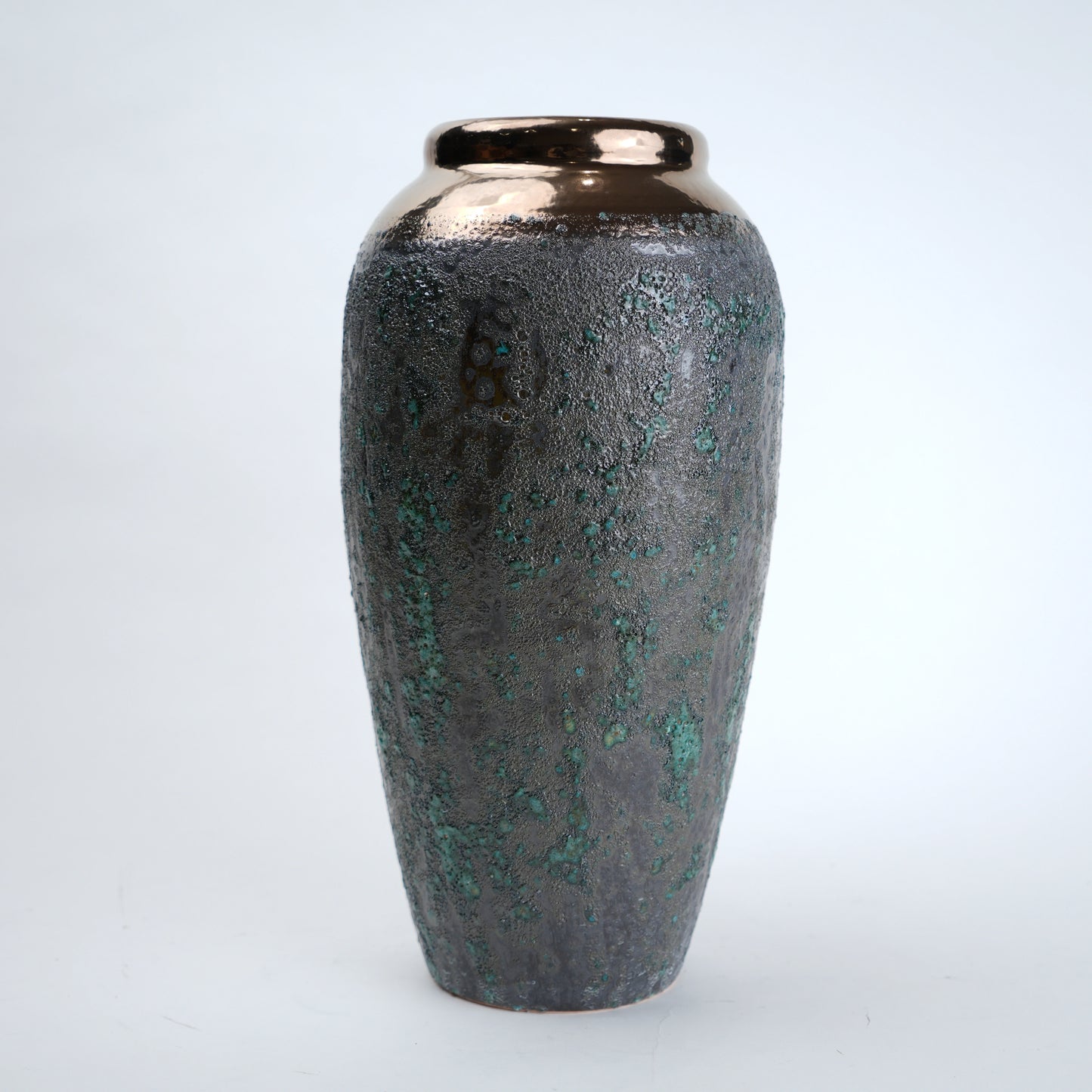 Decorative vase with a textured surface on a white background