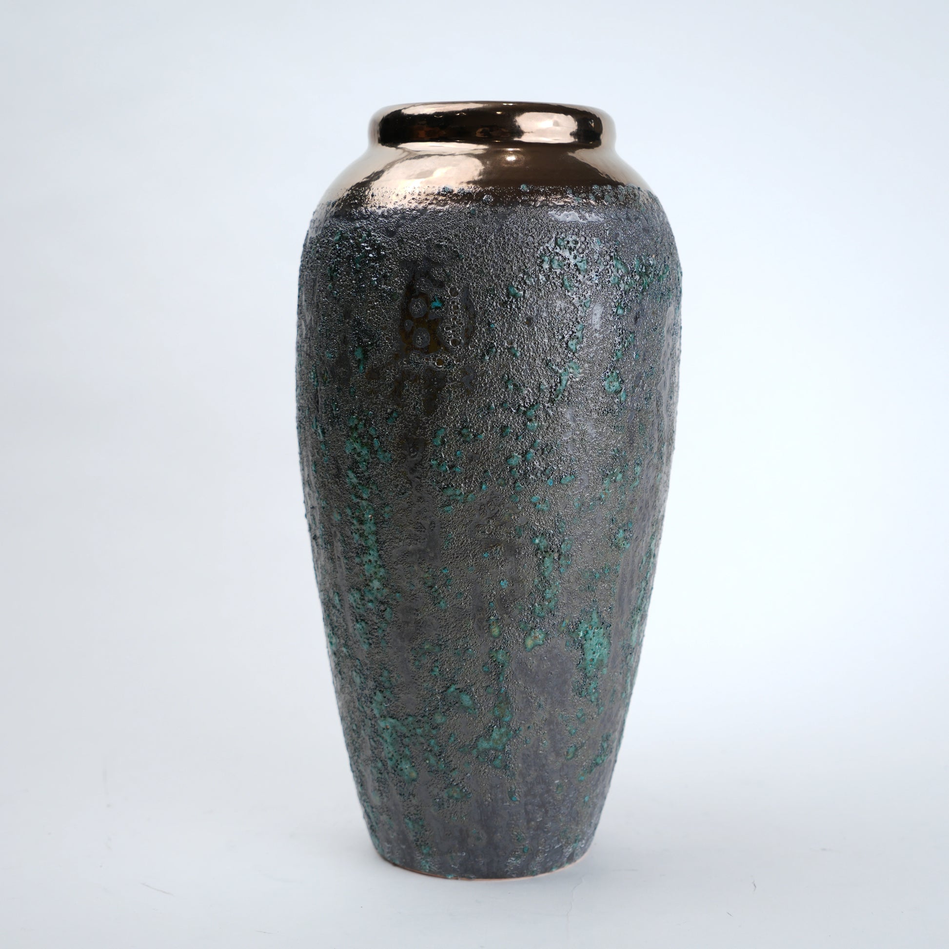 Decorative vase with a textured surface on a white background