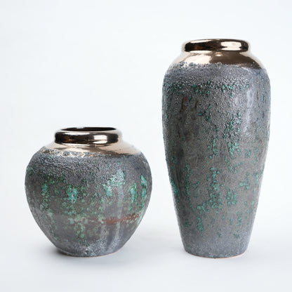 green charcoal ceramic vase with patina texture and bronze neck