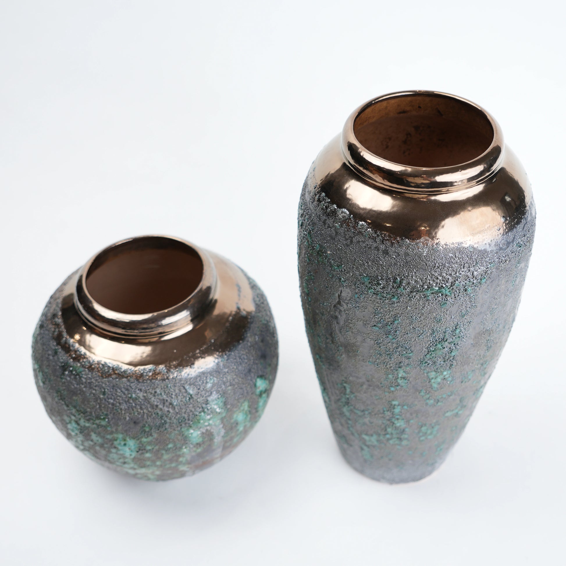green charcoal ceramic vase with patina texture and bronze neck