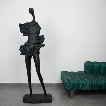 tall black sculpture human form living room statement piece