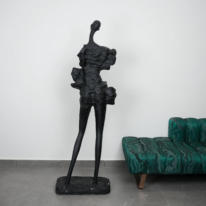 Abstract human sculpt by emerald malachite sofa