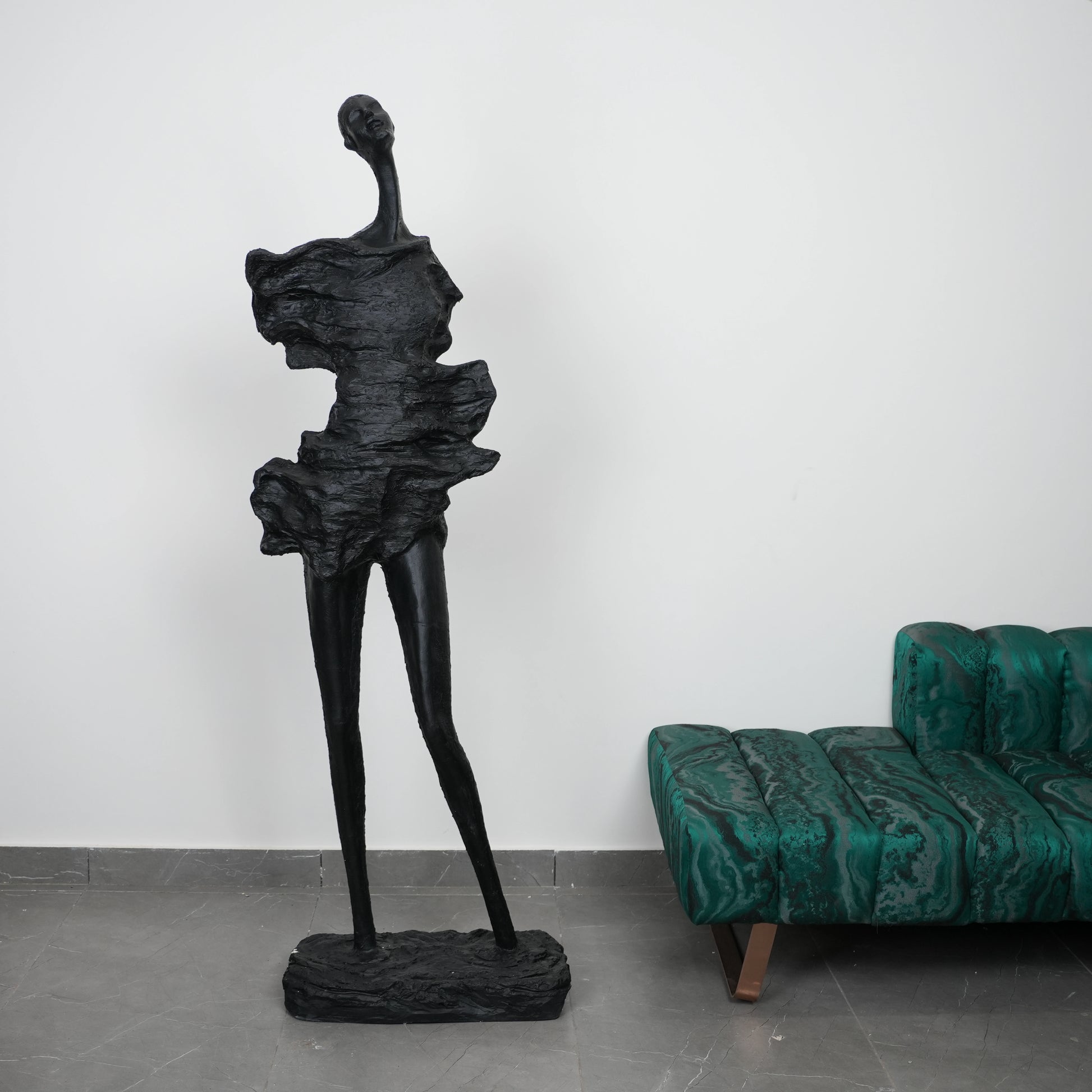 modern abstract sculpture elongated human figure decor