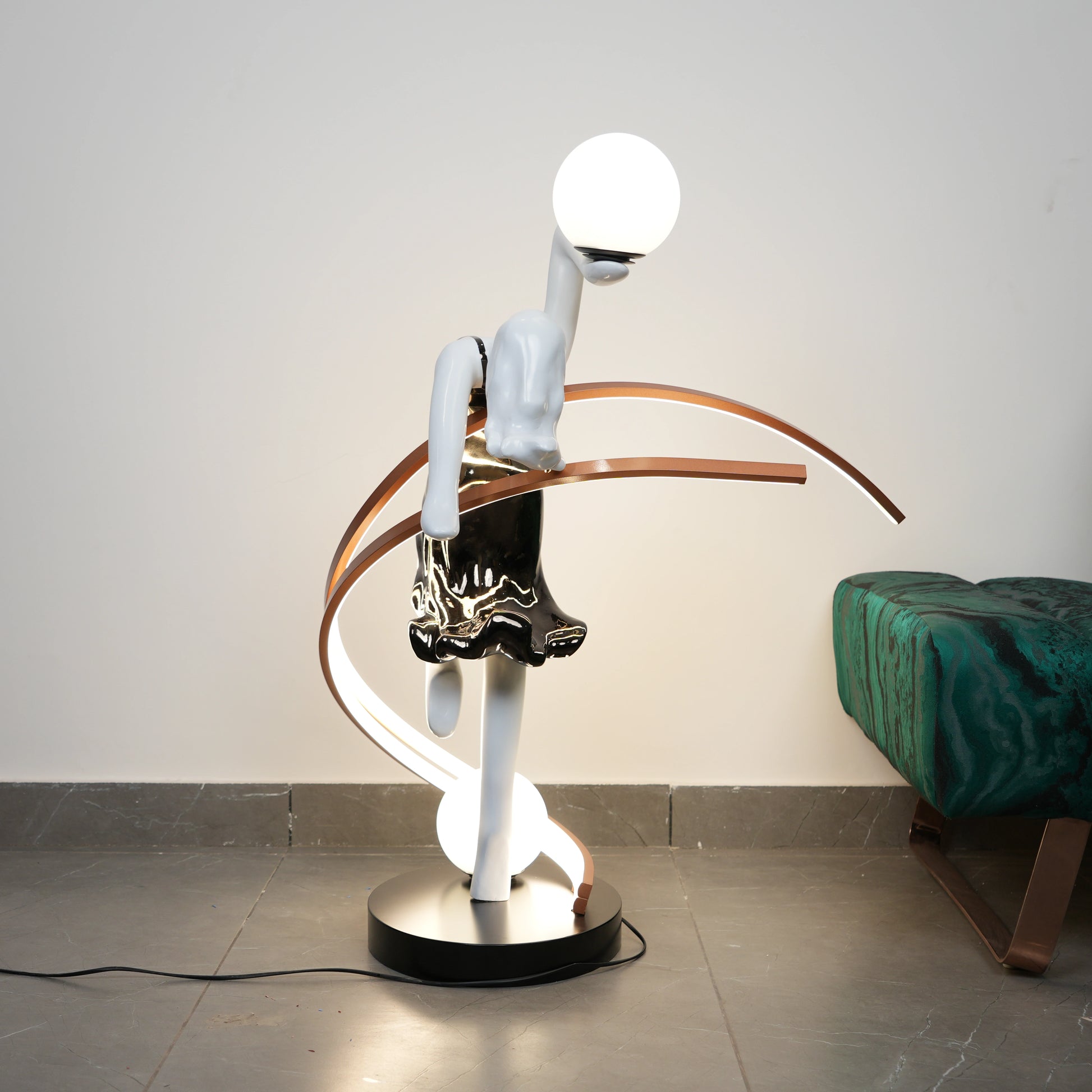 Modern floor lamp with white base and curved wooden arm in a room setting.