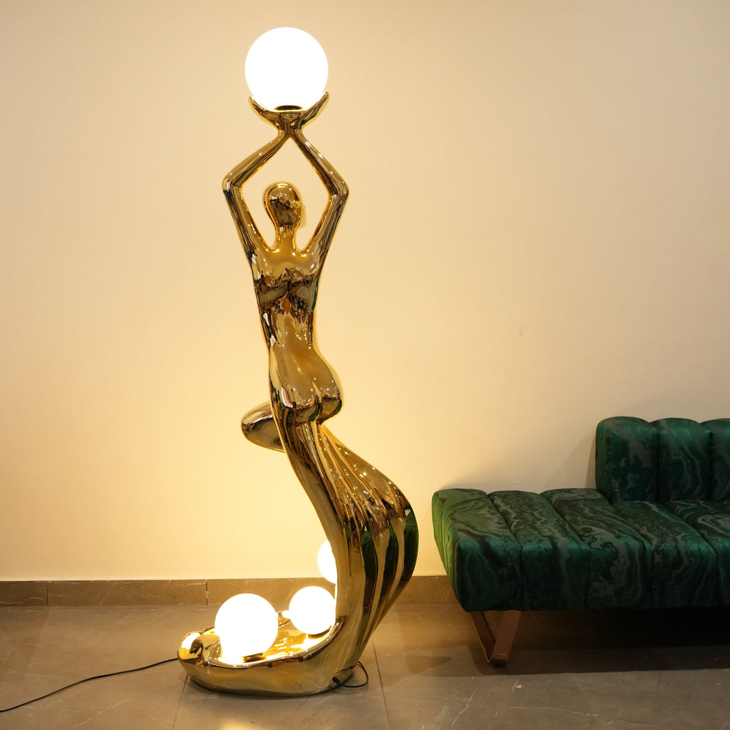 artistic floor lamp with human figure and globe lights