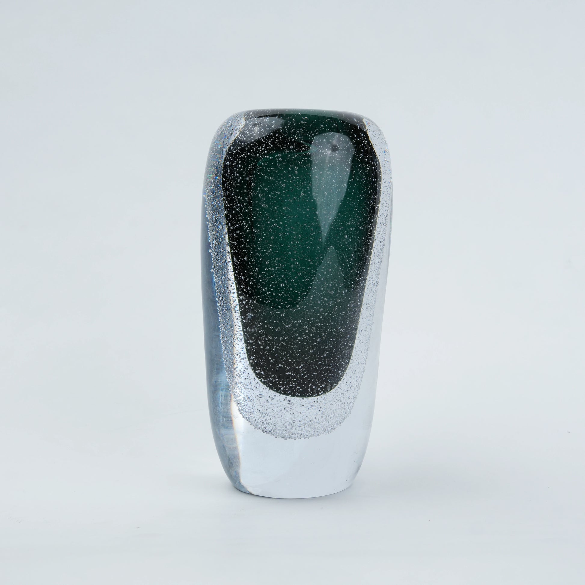Green vase, elongated dark form, front white