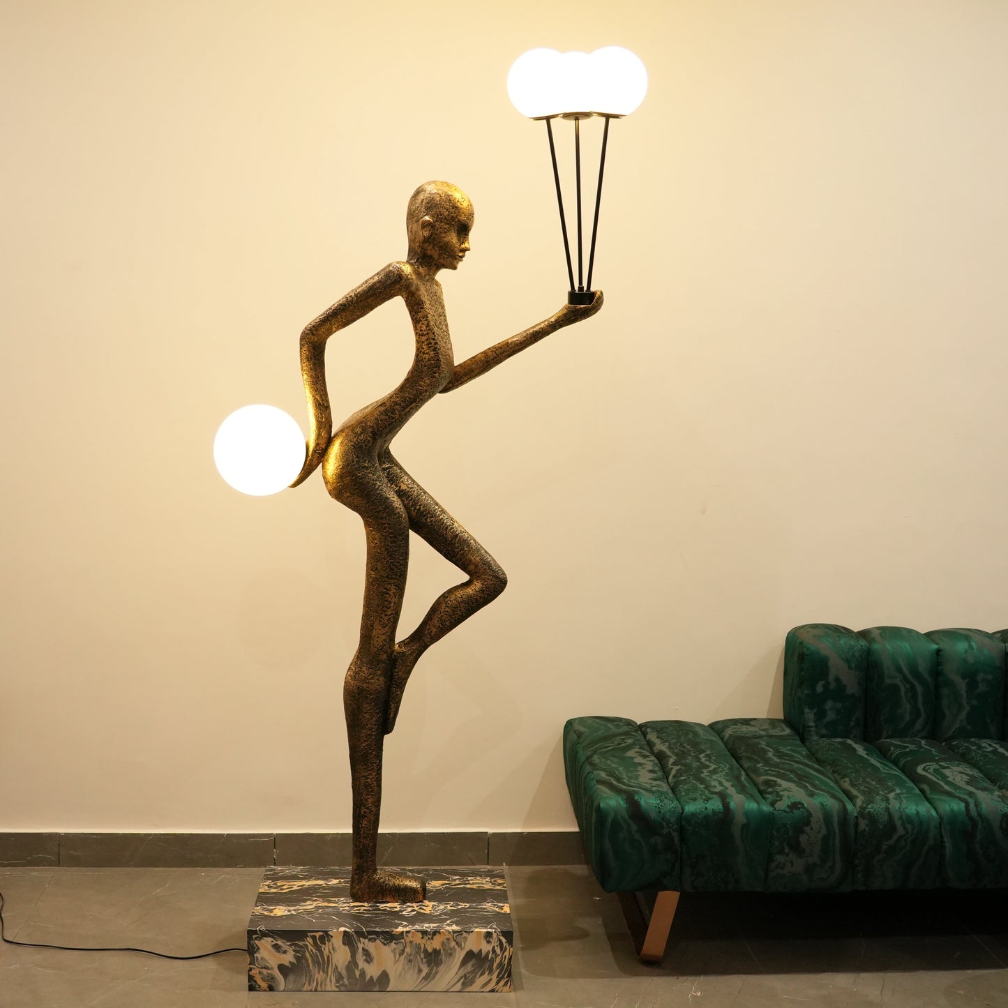 antique gold juggler sculptural floor lamp with orb lights