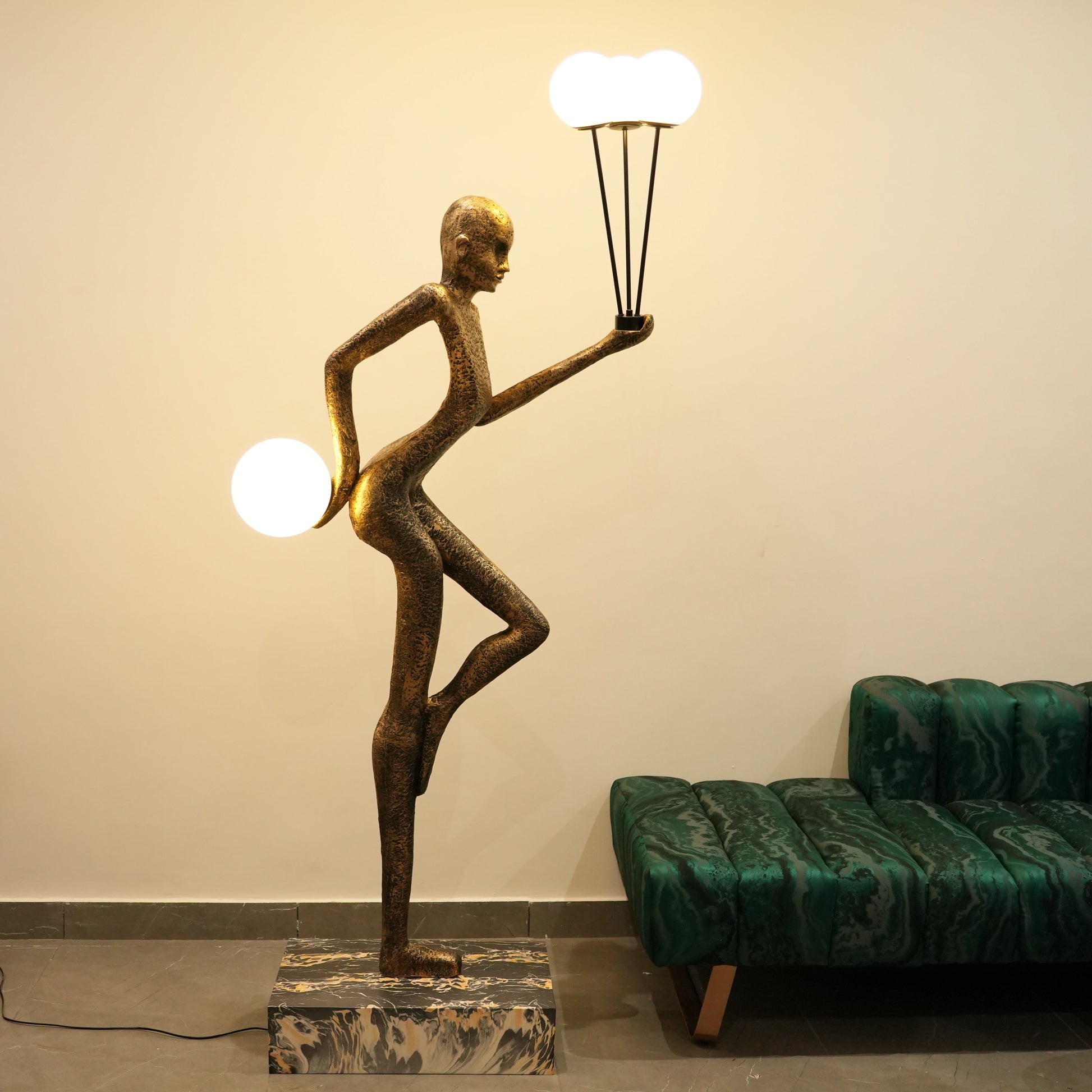 antique gold juggler sculptural floor lamp with orb lights