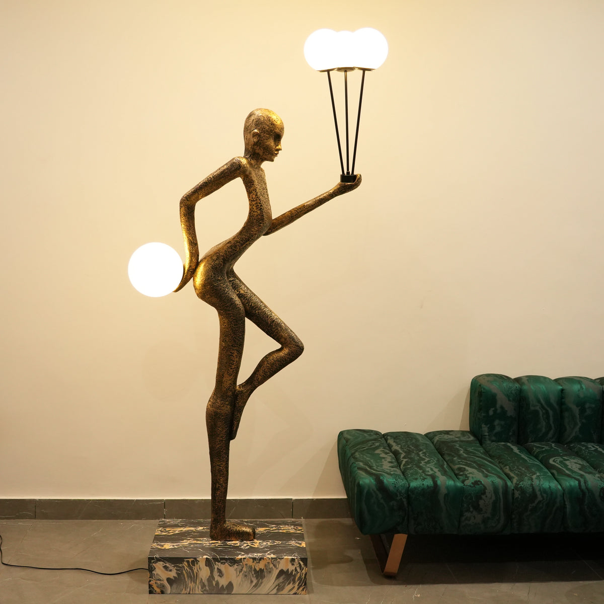 antique gold juggler sculptural floor lamp with orb lights